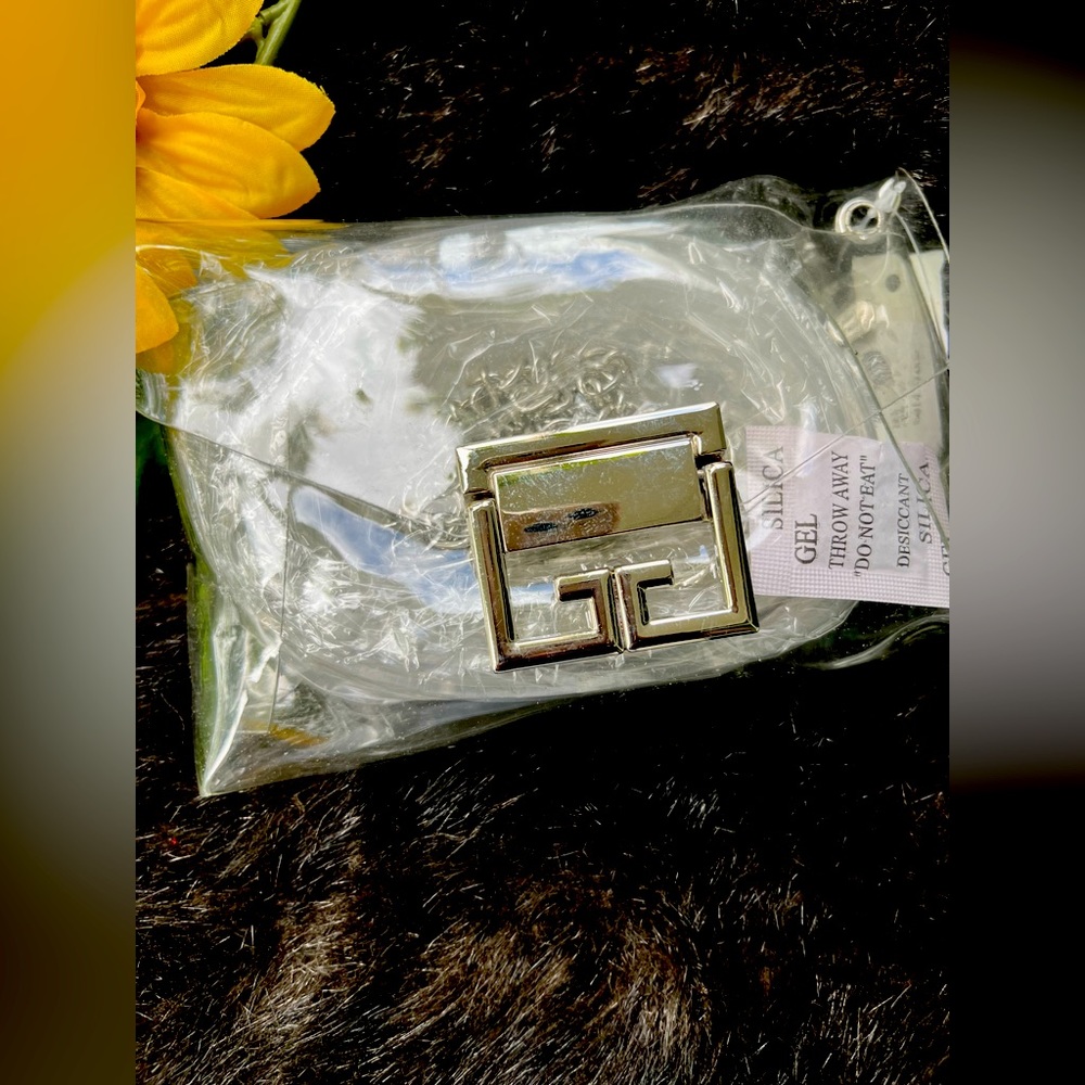 Clear unused 3x4 waist clutch with matching clear belt.